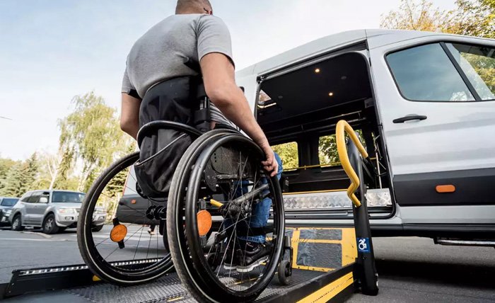 Support worker helping client with transport